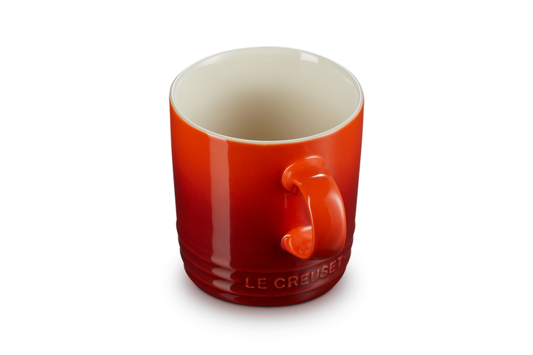 Le Creuset Stoneware Mug in Cerise red, durable and vibrant, available at Keans Claremorris.