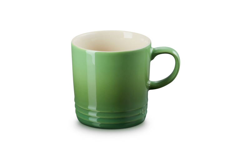 Le Creuset 350ml Bamboo Green stoneware mug, durable, heat-retentive, scratch-resistant glaze – available at Keans
