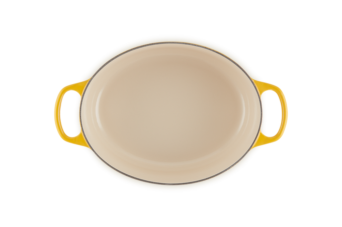 Le Creuset Oval Casserole 27cm in Nectar orange, durable cast iron cookware – available at Keans Claremorris.