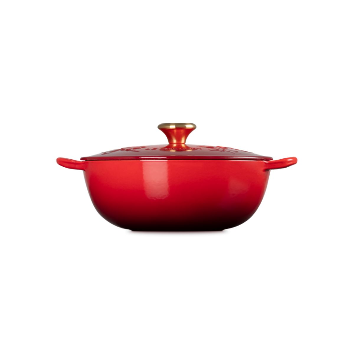 Le Creuset Christmas Soup Pot in holly cerise red with gold knob, side view on white background