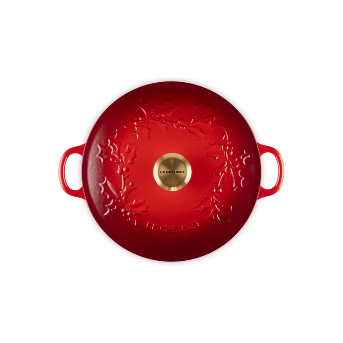 Le Creuset Christmas Soup Pot lid in holly cerise red with embossed holly design and brass knob, top view.