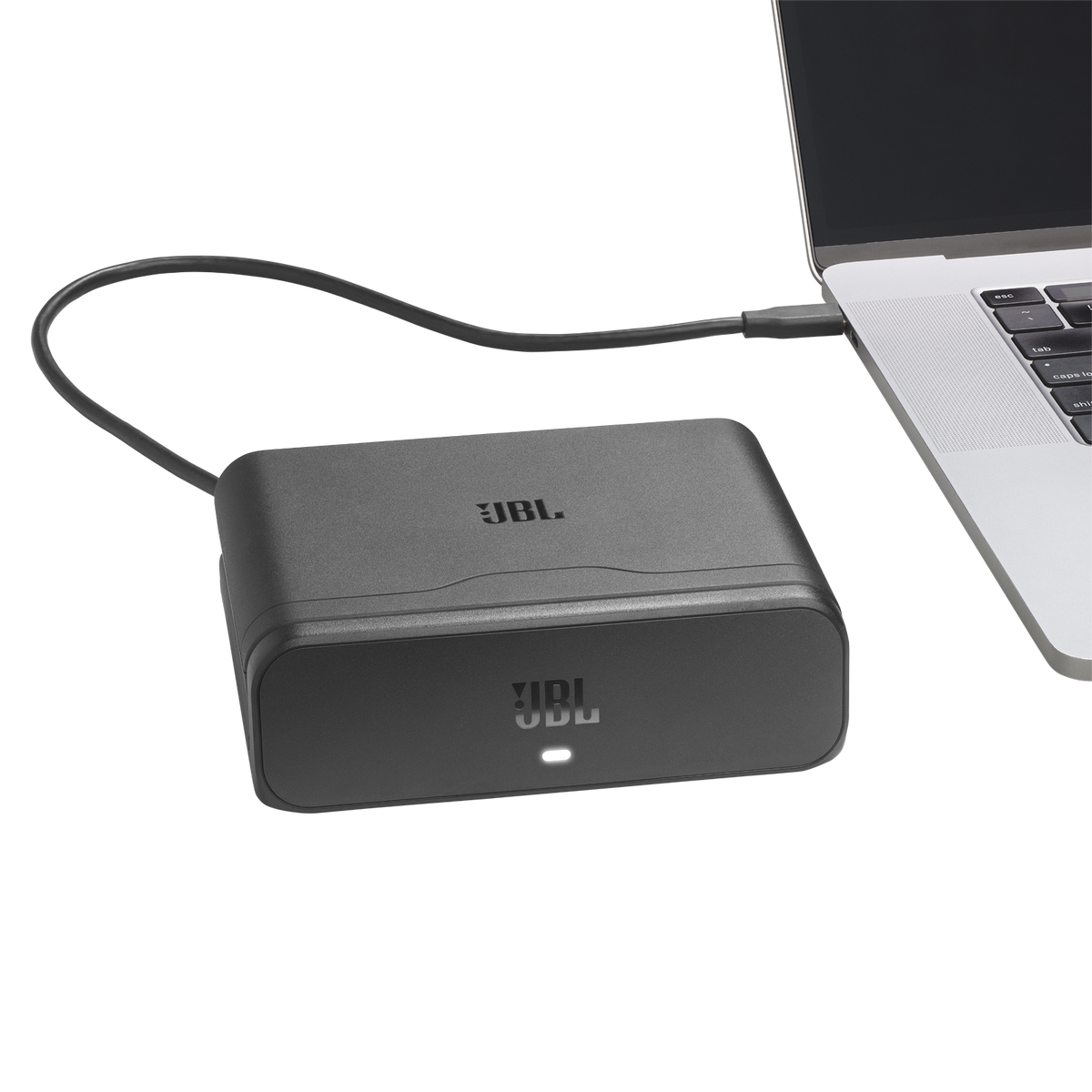 JBL Battery 600 Duo charging case connected to a laptop via USB-C cable with LED indicator light on.