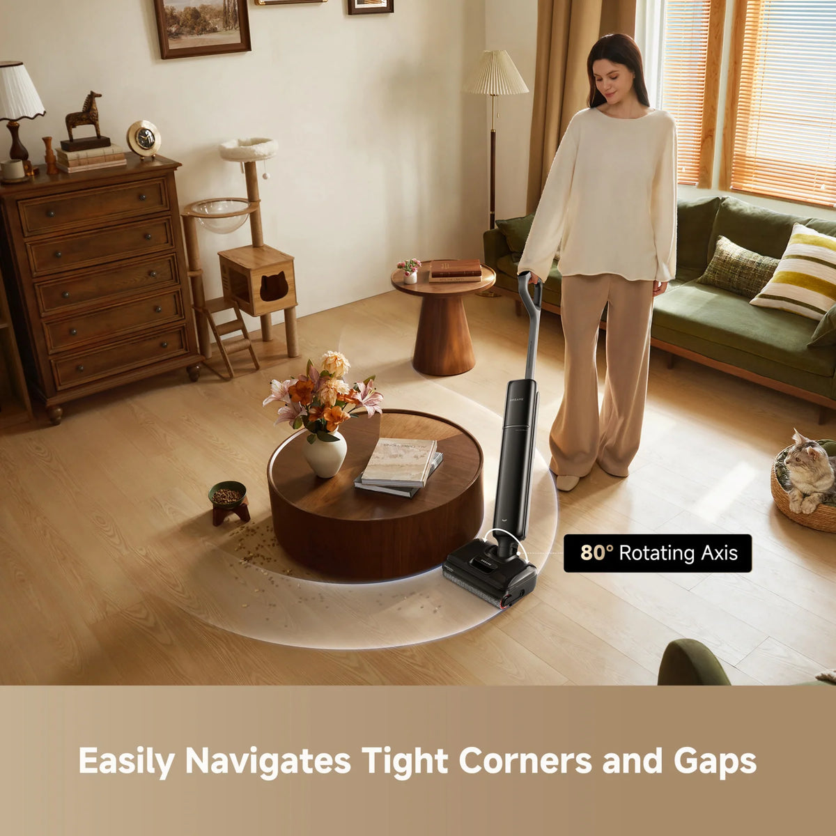 Woman using Dreame T12 Pro cordless vacuum on wooden floor near round coffee table and cat in basket.
