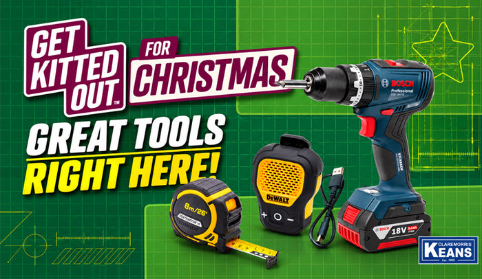 A promotional banner featuring multiple power tools including cordless drills, a drill press, a tape measure, and battery packs from Bosch and Dewalt, alongside work boots, set against a green patterned background with text reading 'Get Kitted Out for Christmas Great Tools Right Here!' and a Keens logo.