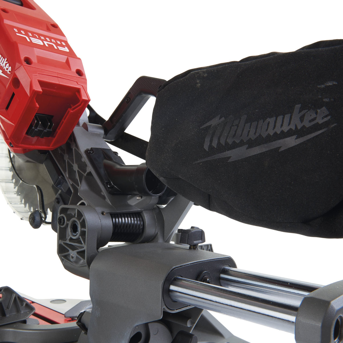 Close-up of Milwaukee M18 Fuel 190mm Mitre Saw showing red motor housing and black dust collection bag.