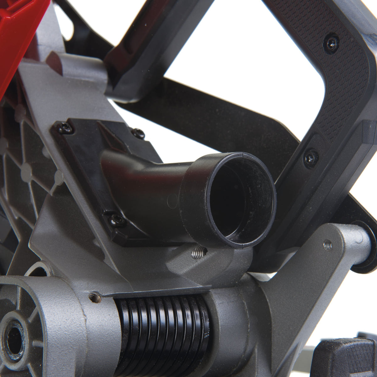 Close-up of the dust extraction port and handle grip on the Milwaukee M18 Fuel 190mm Mitre Saw