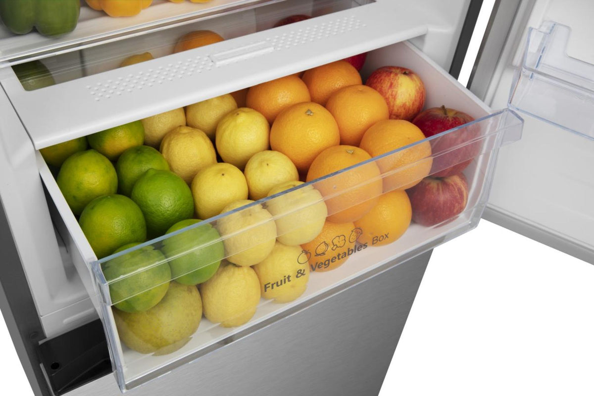 Open crisper drawer of Hisense stainless steel fridge freezer filled with assorted citrus fruits and apples.