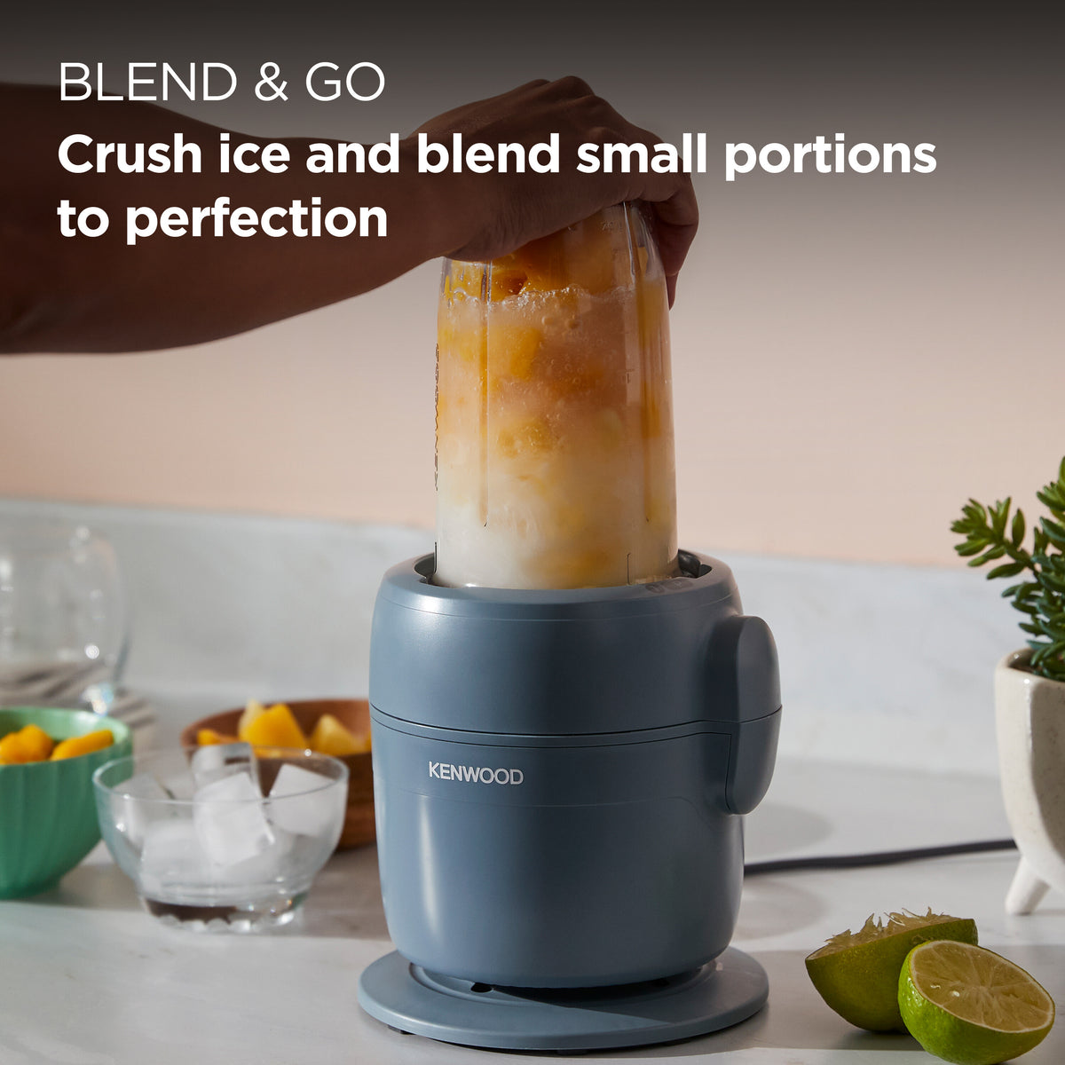 Kenwood Multipro Go Blend Food Processor in storm blue with blending jar filled with fruit and ice.