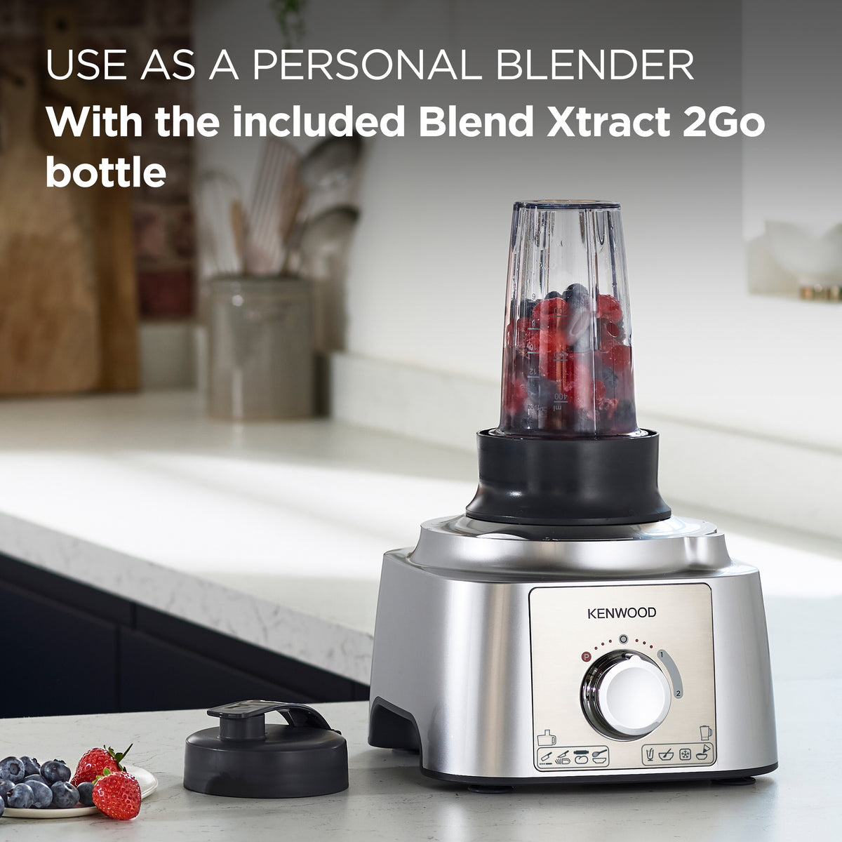 Kenwood MultiPro Express food processor with Blend Xtract 2Go bottle filled with berries on kitchen counter