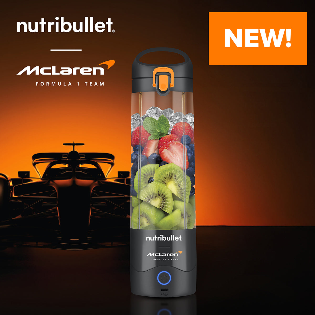Nutribullet Portable McLaren grey blender filled with fruit, with McLaren Formula 1 car silhouette and logo behind.