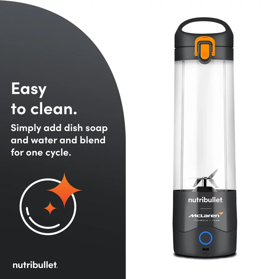 Nutribullet Portable McLaren grey blender cup with black base and orange latch, shown upright on white background.