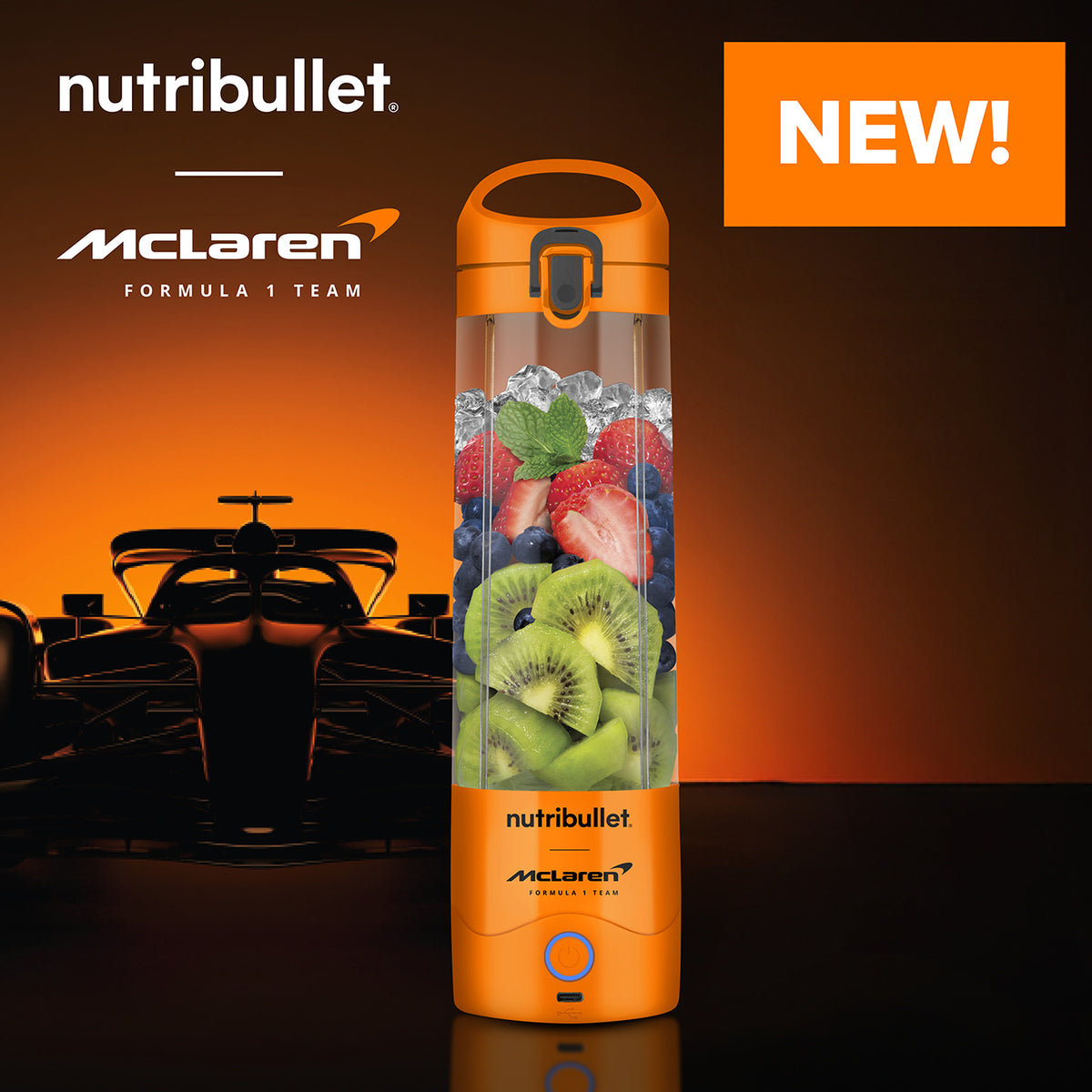 NutriBullet X McLaren Portable Blender in papaya orange filled with fruit and ice, with McLaren F1 car silhouette behind.