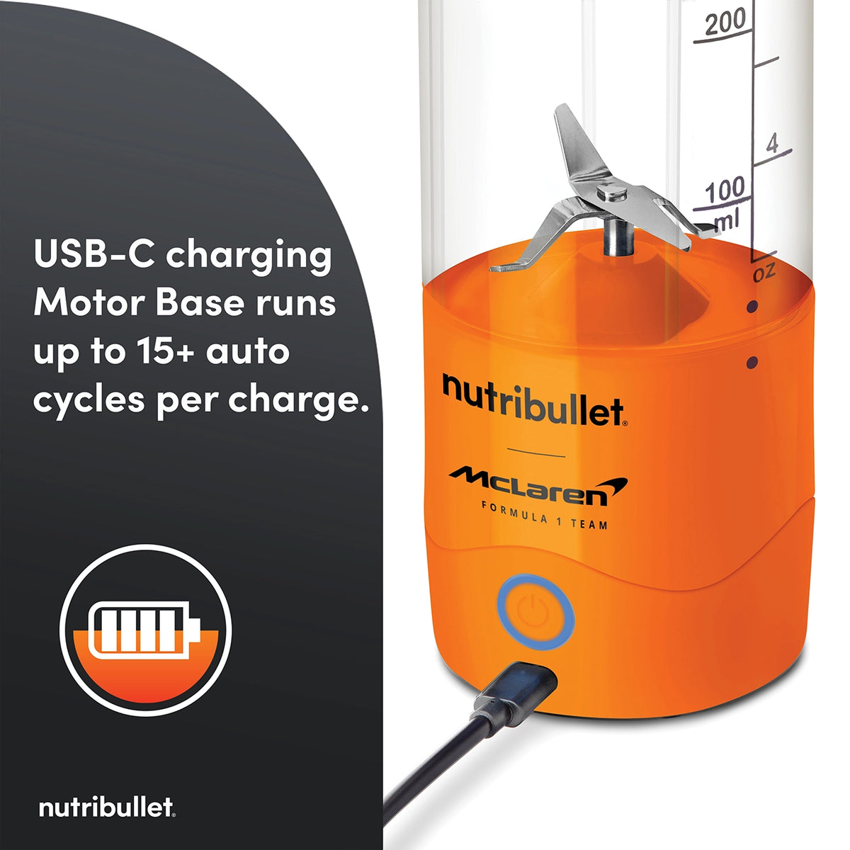 Close-up of the orange Nutribullet Portable McLaren blender base with USB-C charging cable connected