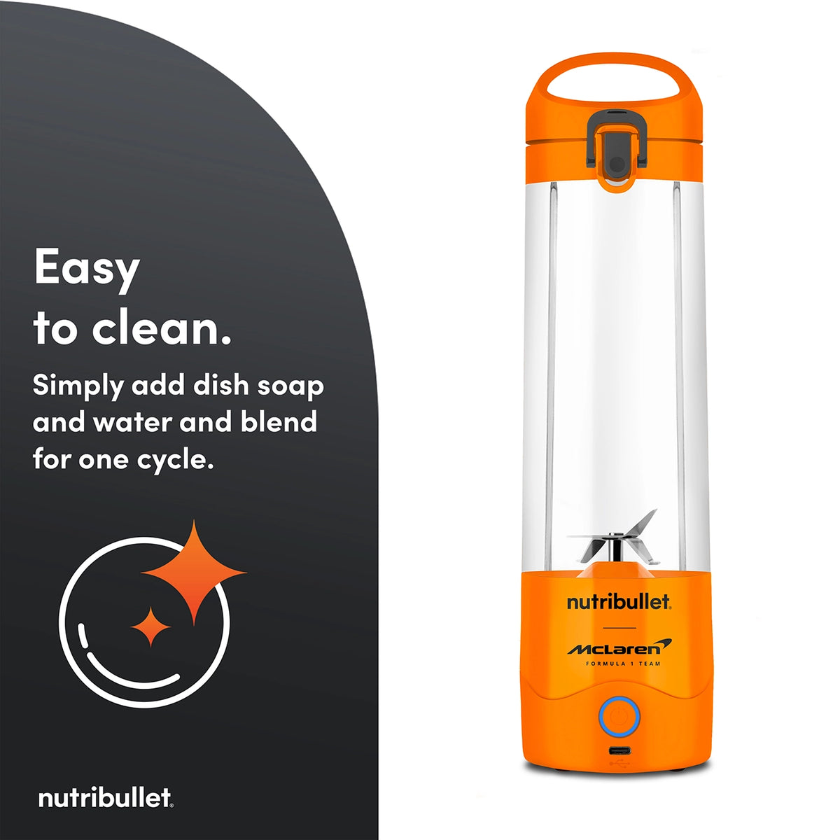 Nutribullet Portable McLaren blender in papaya orange with clear blending cup and power button on white background
