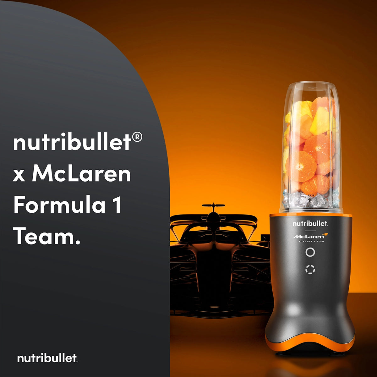 Nutribullet Ultra 1200 McLaren blender with fruit and ice, McLaren F1 car silhouette in background