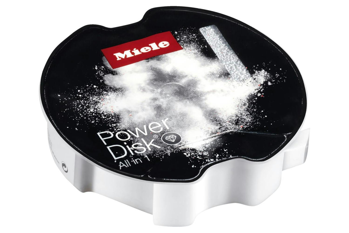Miele PowerDisk All-in-1 dishwasher detergent disk with black top and white powder burst design