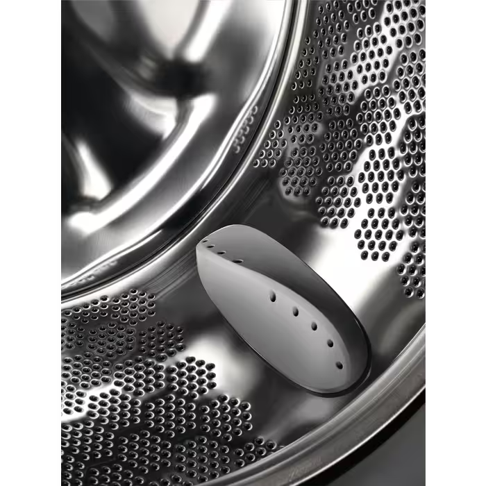 Close-up of the stainless steel drum interior of the Electrolux 10kg Auto Dose 1400 Spin washing machine.