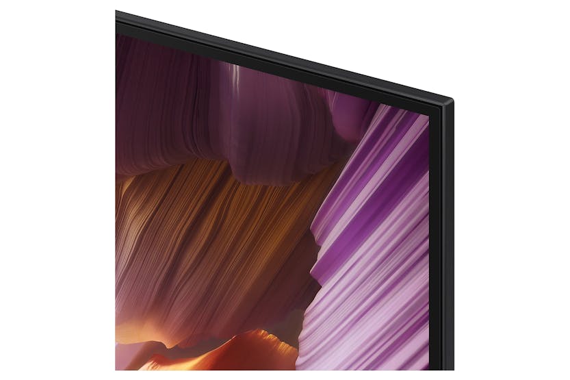 Close-up of the top right corner of the Samsung S85F 83" 4K OLED Smart TV screen and slim black bezel.