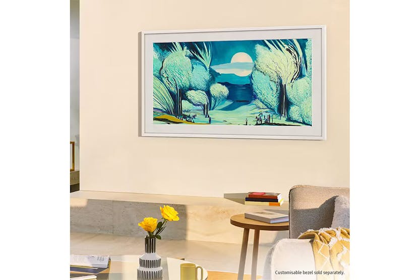 Samsung 65" LS03F QLED 4K Smart TV mounted on wall displaying a blue and green landscape artwork.