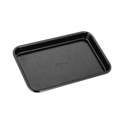 Stellar Bakeware 17x11cm black non-stick single portion baking tray with rolled edges, angled view.