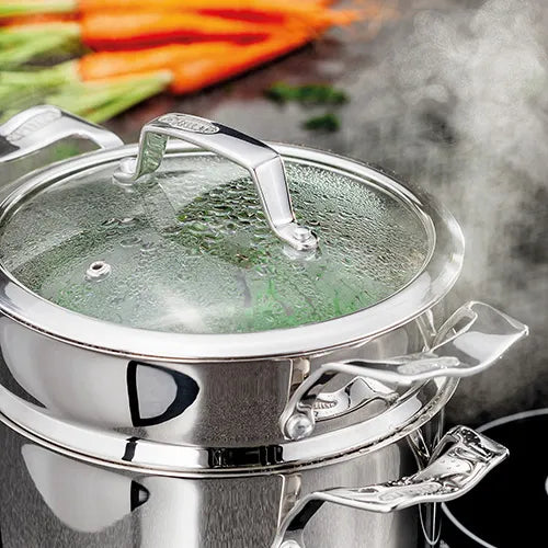 Stainless steel 24cm 3 tier steamer set with glass lid steaming vegetables on stovetop