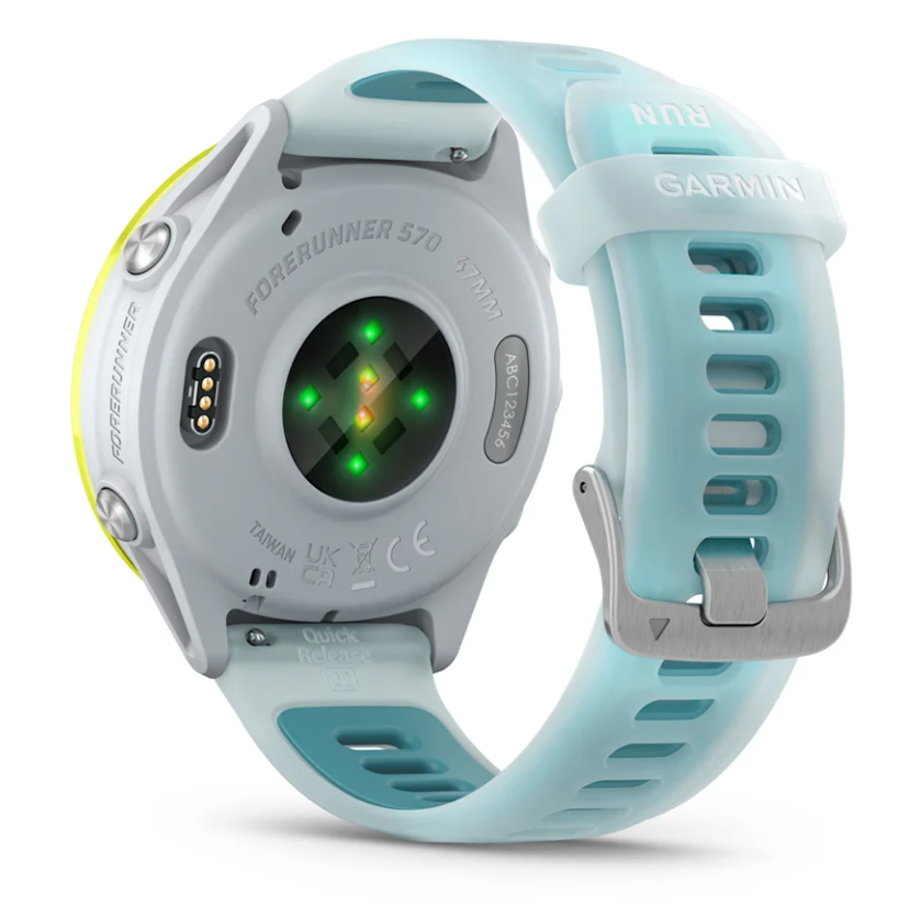 Back view of Garmin Forerunner 570 watch showing heart rate sensor and light blue strap with buckle.