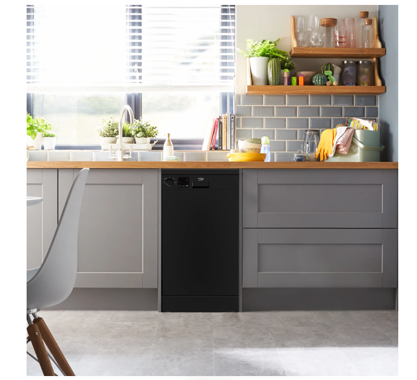 Black Beko Slimline Dishwasher installed under a wooden countertop in a modern kitchen with grey cabinets.