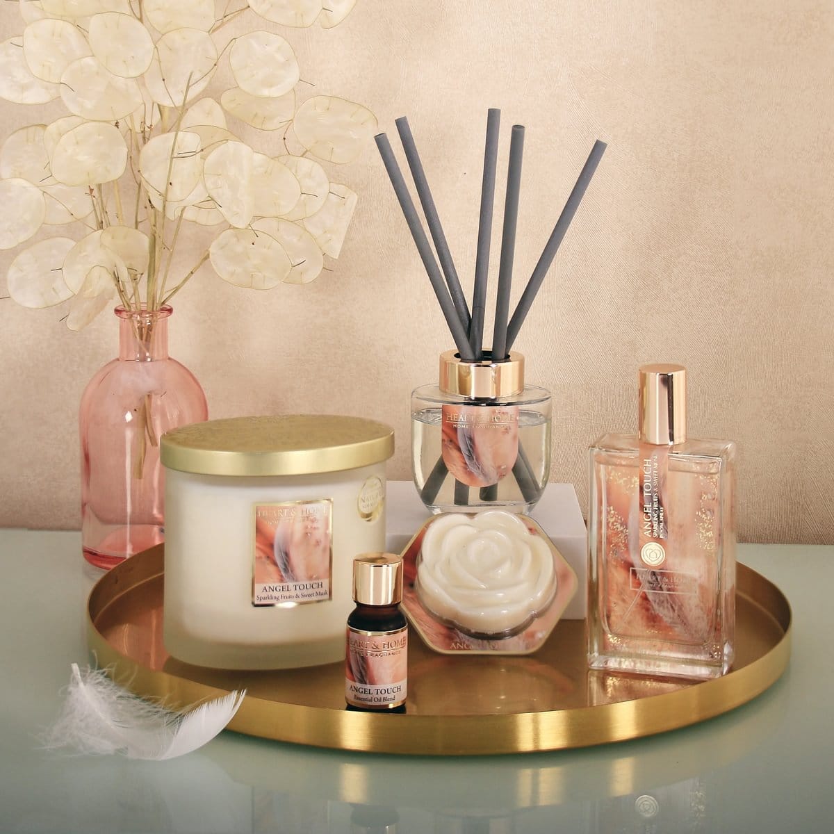 Twin Wick Ellipse Angel Touch candle with diffuser, essential oil, and rose-shaped wax on gold tray