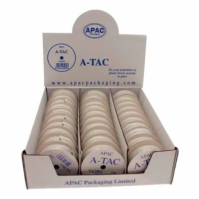 Display box with multiple rolls of A-Tac Green 1m adhesive tape, showing product labels and packaging.