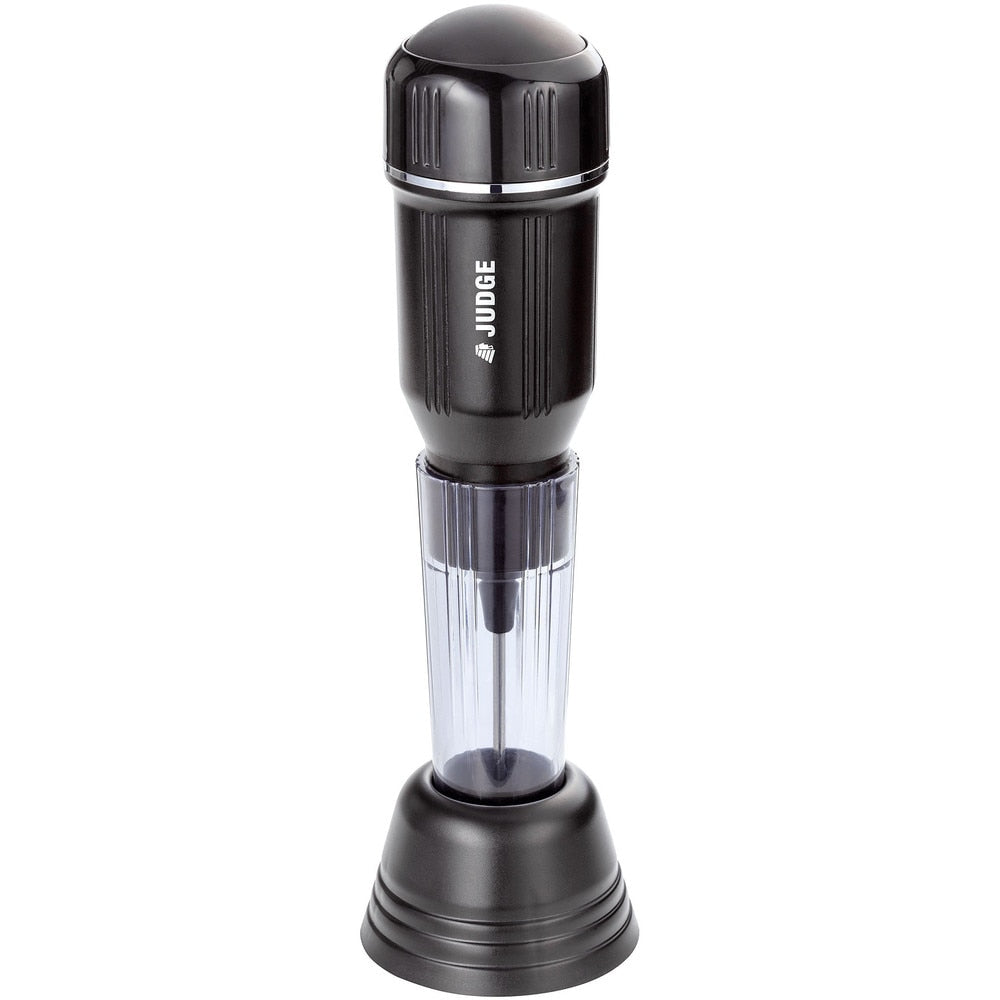 Judge Kitchen milk frother in black with clear mixing chamber and stand on white background.