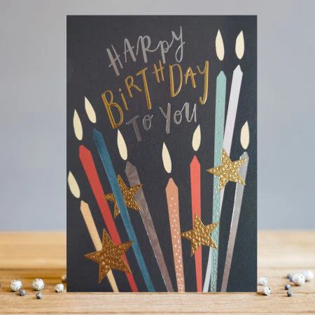 HB Candles Card with colorful illustrated candles and gold stars on black background, "Happy Birthday to You" text.