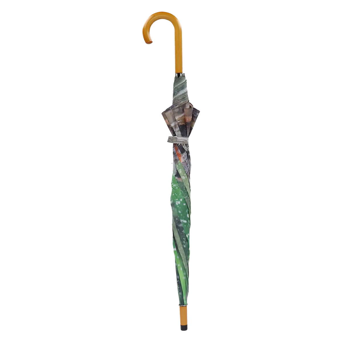 Closed umbrella with a curved wooden handle and a bathing birds patterned canopy in green and gray tones