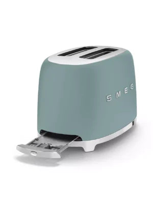 Smeg 50’s Retro Style 2 Slice Toaster in emerald green with crumb tray open, angled view.