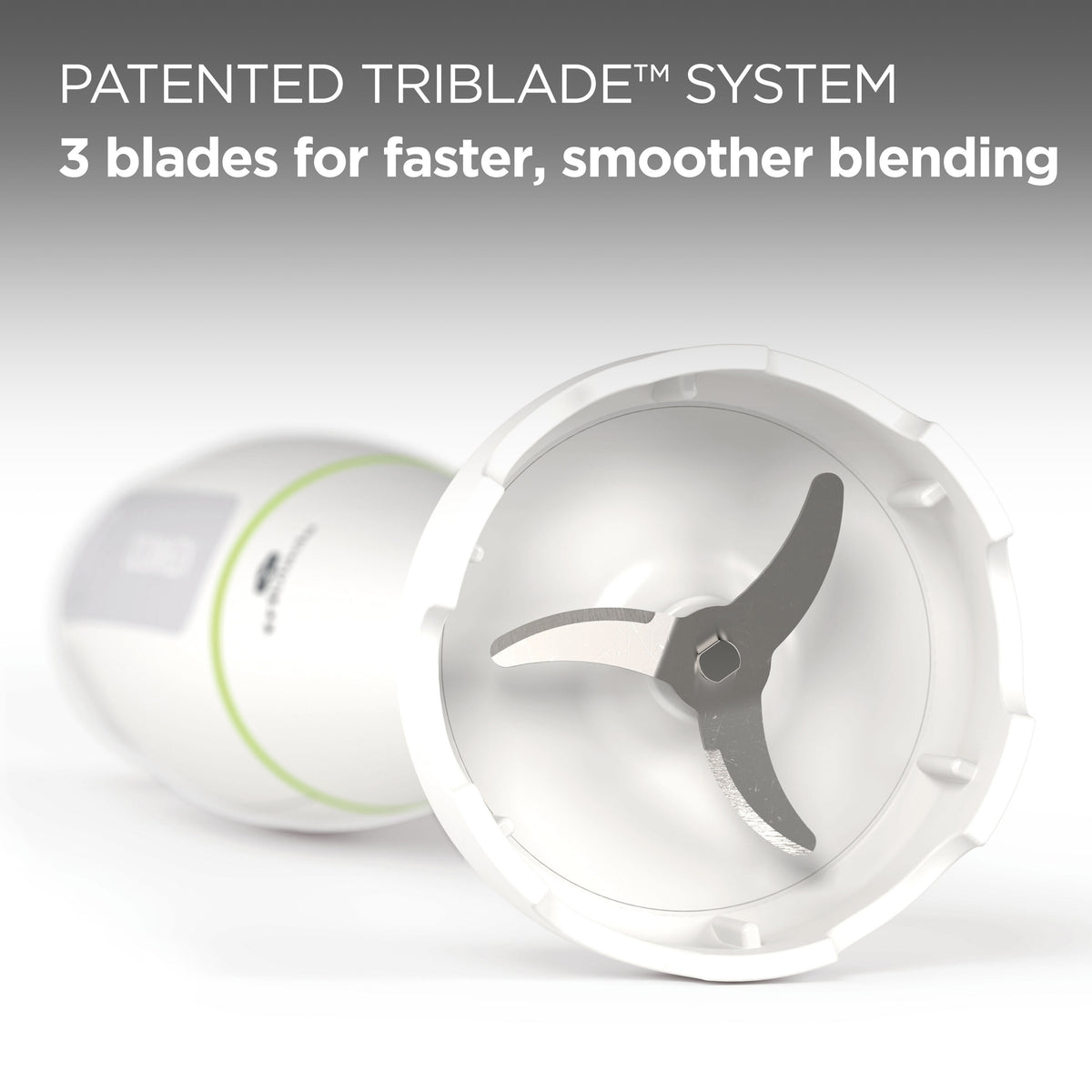 Close-up of the Kenwood Triblade System HDP100WG showing its three stainless steel blades inside a white blending attachment.