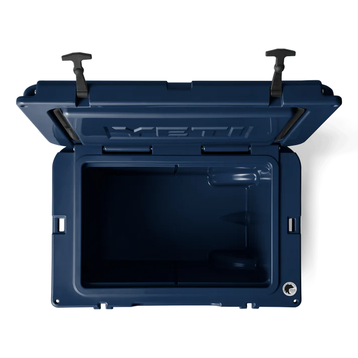 Open top view of the navy Tundra Haul wheeled cooler showing its spacious interior and secure latches.