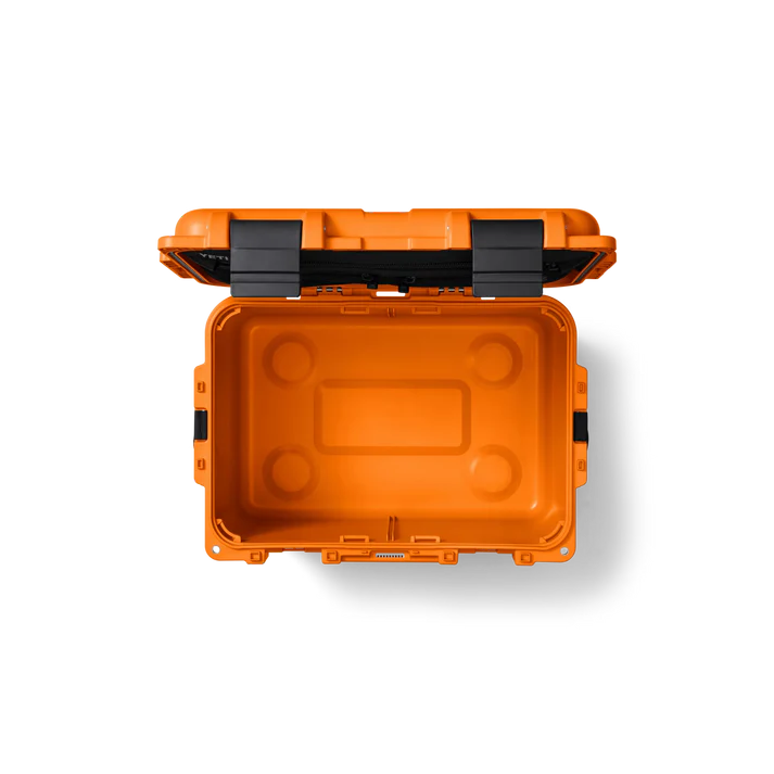Open Yeti Loadout Gobox 30 Gear Case 2.0 in King Crab orange showing empty interior and black latches.
