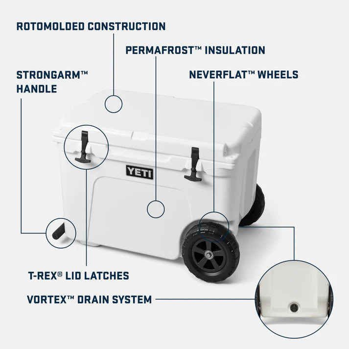White Tundra Haul Navy wheeled cooler with black wheels and latches, showing key features callouts.