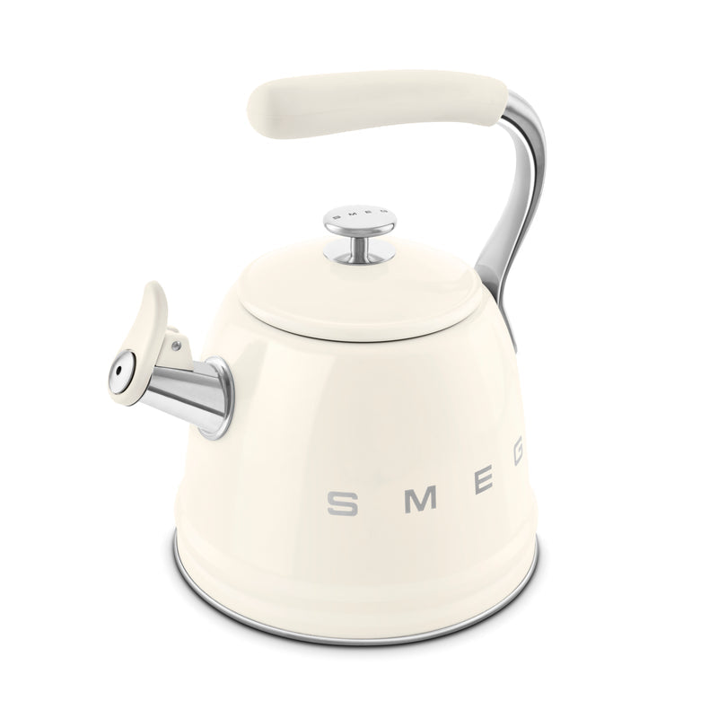 Cream Smeg 50's retro style whistling kettle with curved handle and spout cover, side view on white background