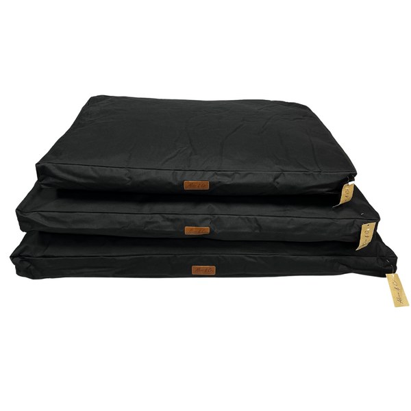 Black waterproof large Coco plain cushion, dirt-resistant, ideal for home or kennel, from Keans Claremorris.