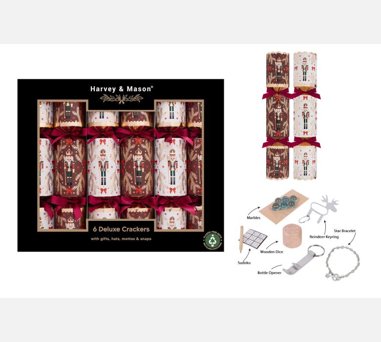 Harvey & Mason 6 Deluxe Crackers gift set shown with the retail box, three unpackaged crackers with red ribbons, and a set of included outdoor accessories such as a whistle, tinder, wooden disc, bottle opener, keychain, and star burner, on a white background.