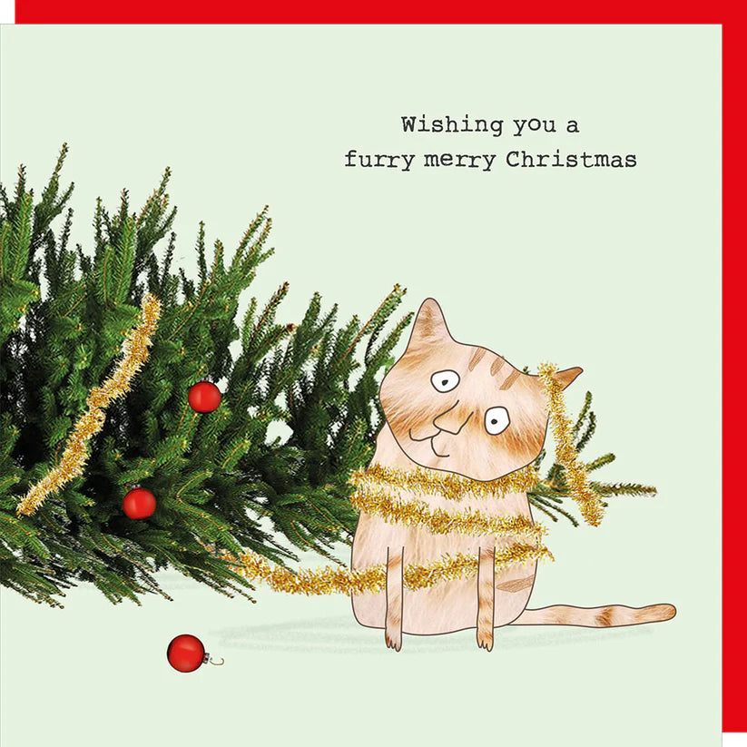 Christmas card with a cat tangled in gold tinsel beside a decorated pine branch and the text "Wishing you a furry merry