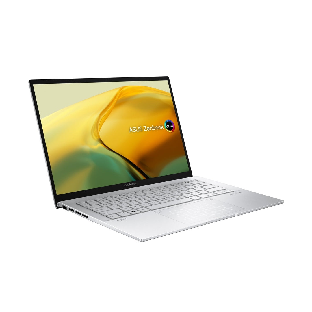 Asus 14" ZenBook Evo laptop in foggy silver, angled view showing keyboard and screen with yellow-green wallpaper