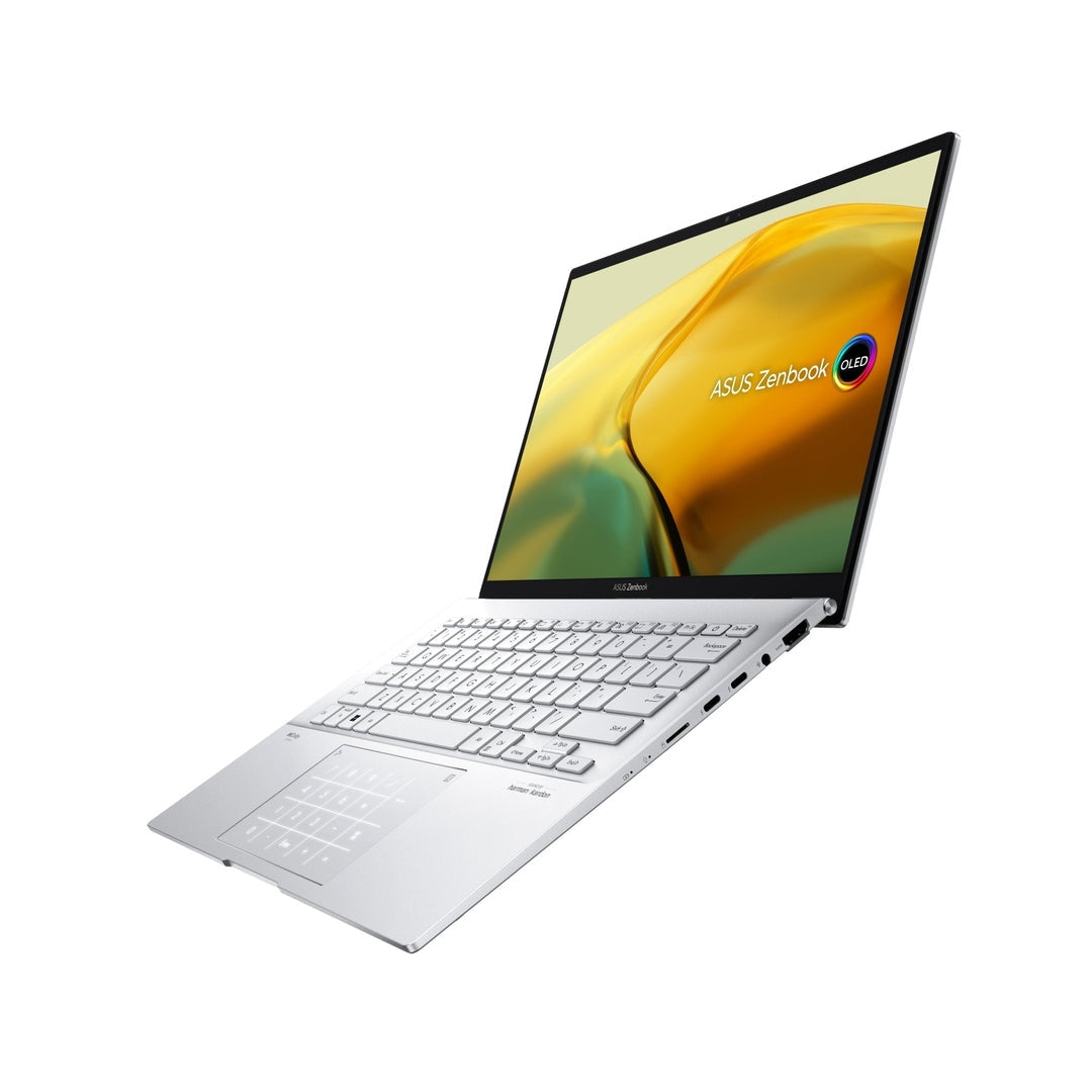 Asus 14" ZenBook Evo laptop in foggy silver, angled view showing keyboard and screen with yellow-green wallpaper
