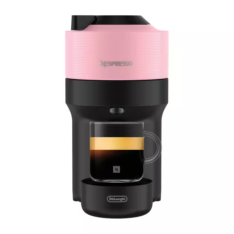 Delonghi Nespresso Vertuo Pop coffee machine in pink with a glass cup of espresso beneath the spout.