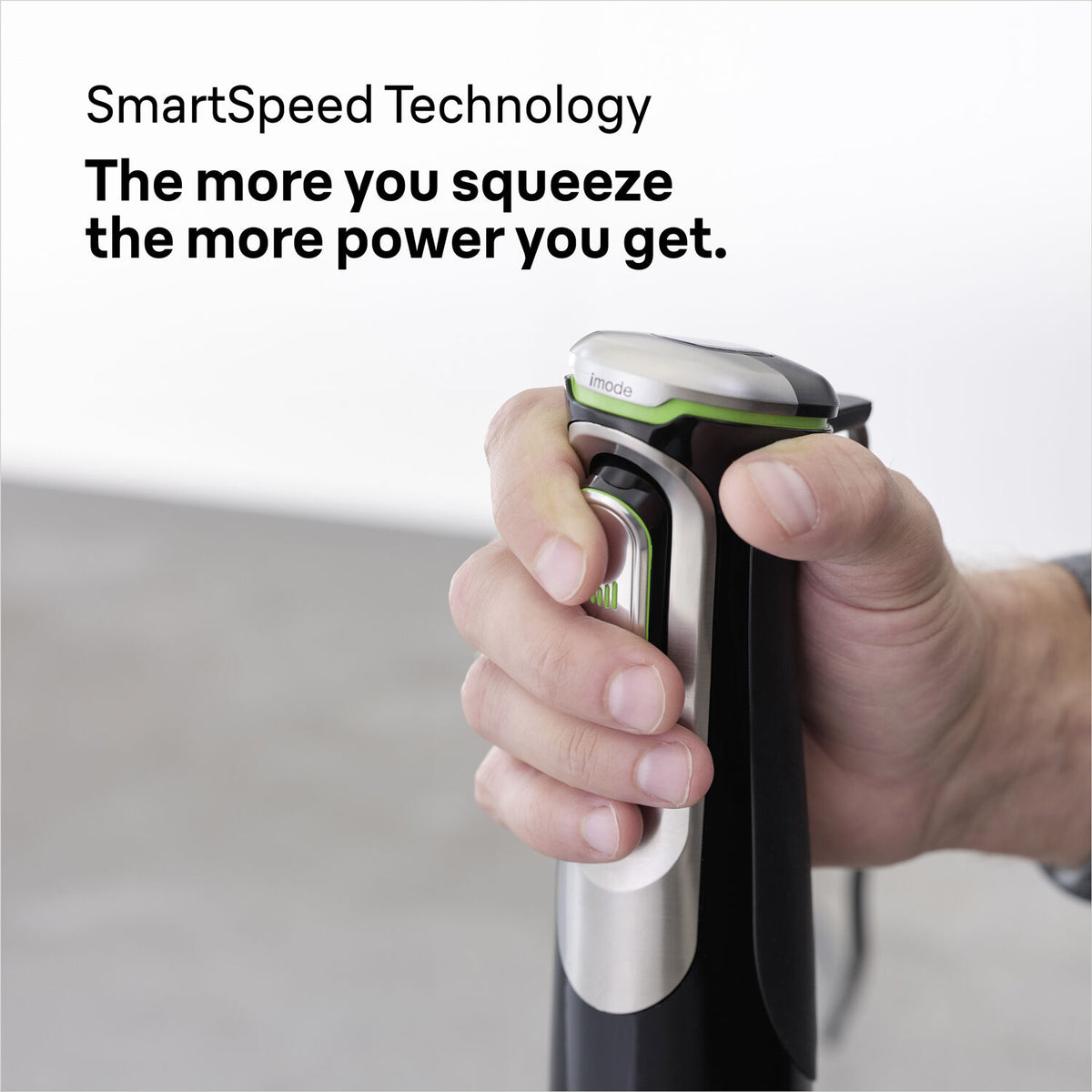 Hand gripping the power button on the Braun Multiquick 9 Hand Blender black model MQ9138XI.