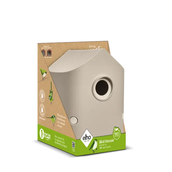 Beige mushroom-shaped cosy bird house displayed in eco-friendly packaging with green and brown accents.