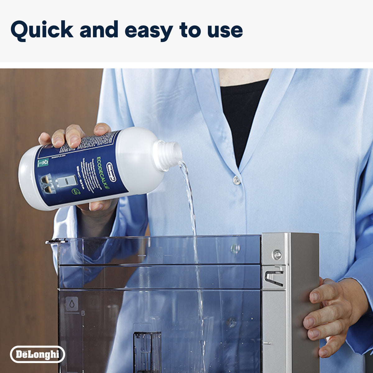 Person pouring DeLonghi Descaler liquid into a coffee machine water tank for cleaning.