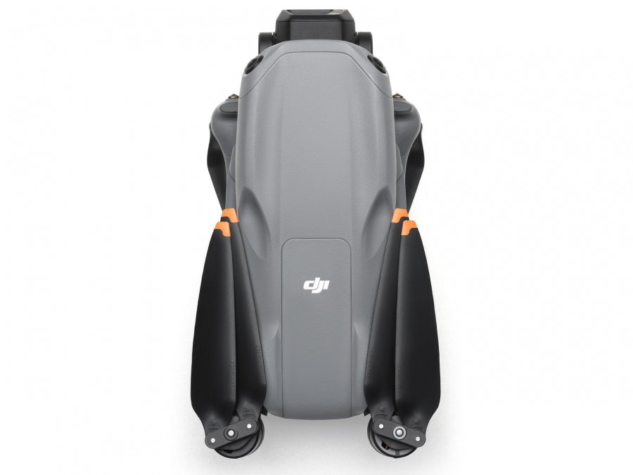 Folded DJI Air 3S RC-N3 drone showing top view with gray body and black propellers with orange tips.