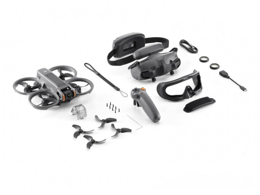 Drone components including drone, propellers, remote control, and accessories on a white background