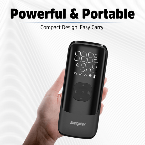 Hand holding Energizer Portable Air Compressor with digital display and control buttons visible